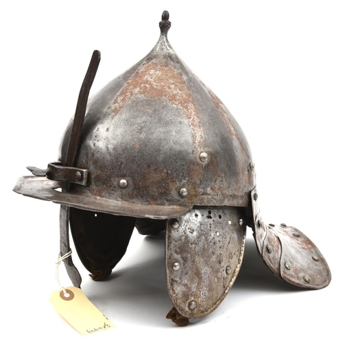 634 - A 17th century style continental lobster tail helmet, pointed top to skull with acorn finial, plain ... 