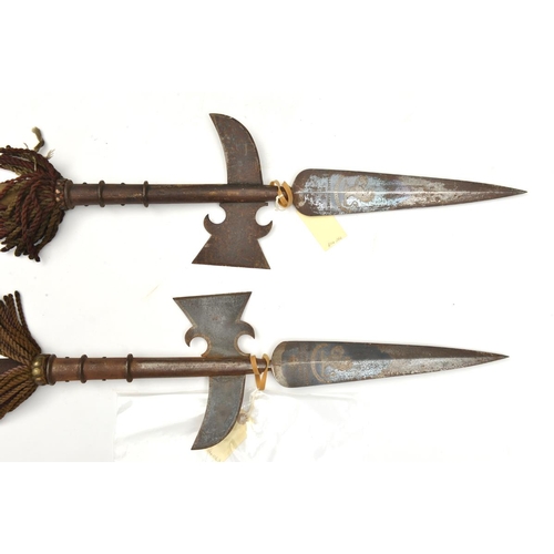 633 - A pair of Victorian Royal Forester’s ceremonial halberds, blued steel heads with tubular sockets, th... 