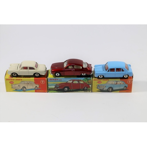 352 - 3 Dinky Toys. Morris 1100 (140) in light blue with red interior. Volkswagen 1500 (144) in cream with... 