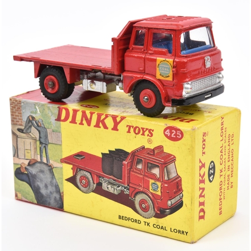 412 - A Dinky Toys Bedford TK Coal Lorry (425). Hall & Co. in red with 6x coal sacks and scales. Boxed, mi... 