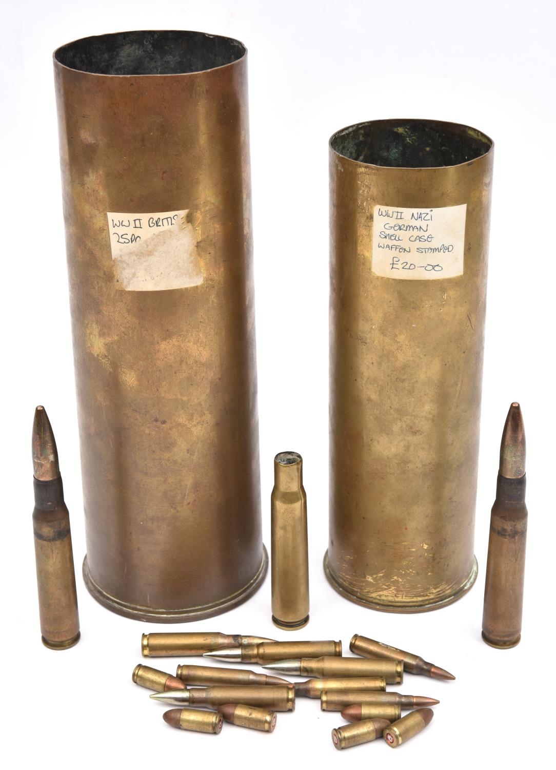 A WWII German 75mm brass shell case, the base bearing Waffenamt eagle mark;  a British 25 pounder bra