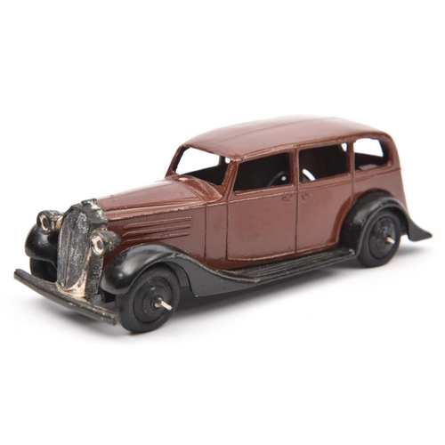 1383 - Dinky Toys 30 Series Vauxhall (30d). In dark brown with closed black chassis, black ridged wheels an... 