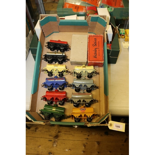 1089 - 10 Hornby O gauge 4 wheel tank wagons. An early open lattice framed PRATTS in dark green, another la... 