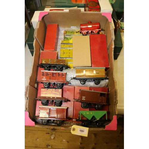 1091 - 8 Hornby O gauge railway freight wagons. Hopper wagon LMS. Cattle truck, NE. Goods van, NE. Flat tru... 