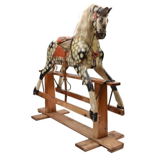 1171 - A traditional English produced children's hand carved wooden rocking horse. The horse is mounted on ... 