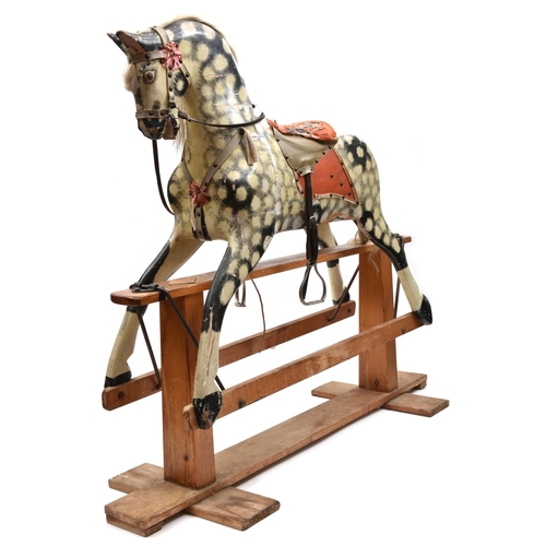 1171 - A traditional English produced children's hand carved wooden rocking horse. The horse is mounted on ... 