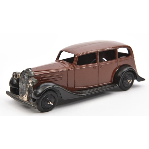 1383 - Dinky Toys 30 Series Vauxhall (30d). In dark brown with closed black chassis, black ridged wheels an... 