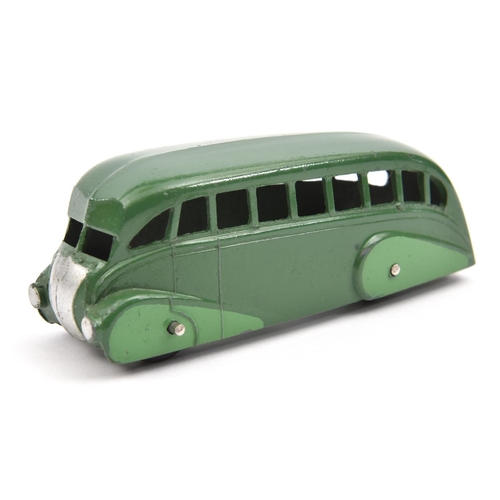 1389 - Dinky Toys Streamlined Bus (29b). In dark green with mid green side panels, black ridged wheels with... 