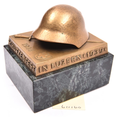 531 - A Swiss military shooting competition rectangular brass desk paperweight,  surmounted by  a steel he... 