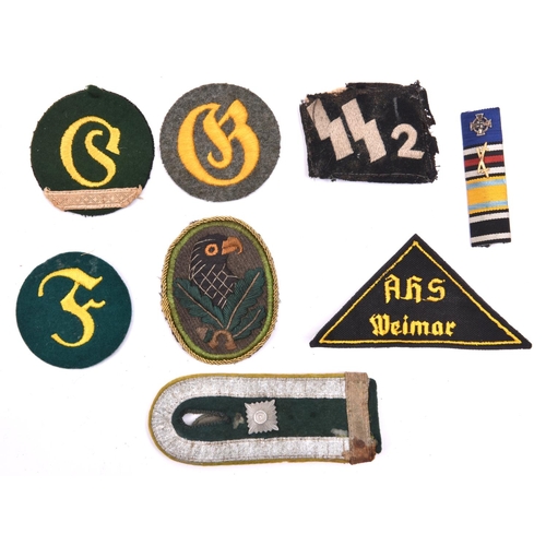 560 - Third Reich cloth insignia:  embroidered Sniper’s badge; SS collar patch (mothed and worn); feldwebe... 