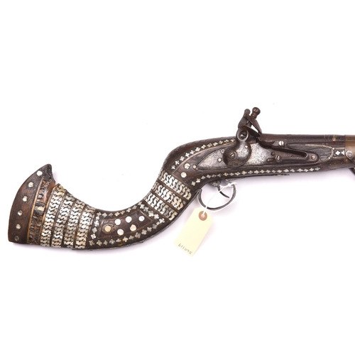 695 - A decorative Indian flintlock gun,  65” overall, barrel 50”, with EIC musket lock and fullstock deco... 