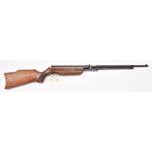 752 - A .22” Relum Tornado underlever air rifle,  number 17401, with varnished beech stock having grooved ... 