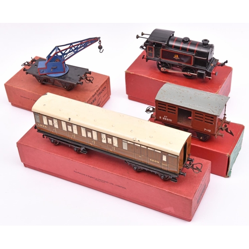 1058 - 10x Hornby O gauge railway items. A No.40 clockwork BR 0-4-0T locomotive, 82011, in lined black live... 