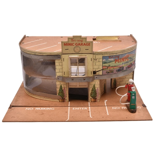 1173 - 1950's Tri-ang Toys 2 Story Garage and Showroom. Hardboard construction with printed detailing, with... 