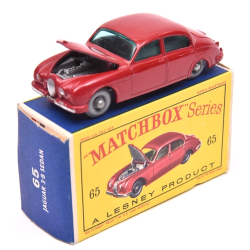 1235 - Matchbox Series No.65 Jaguar 3.8 Sedan. In red with green windows, grey plastic wheels and silver ba... 