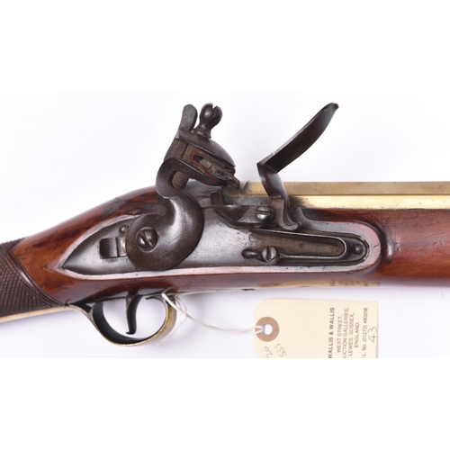 10 - A heavy brass barrelled flintlock blunderbuss of military appearance,  32” overall, unmarked slightl... 