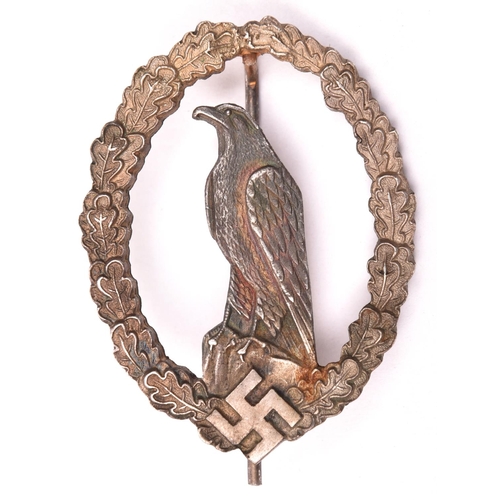 196 - A Third Reich Former Pilot’s Commemorative badge,  silver washed with grey eagle and round pin. GC