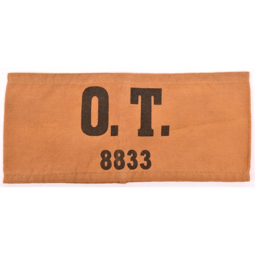 201 - A Third Reich armband,  black “O T 8833” on khaki (Organisation Todt), GC