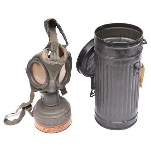 204 - A Third Reich civilian Luftschutz gas mask,  the filter with waffenamt stamp, date 1940, and with pr... 