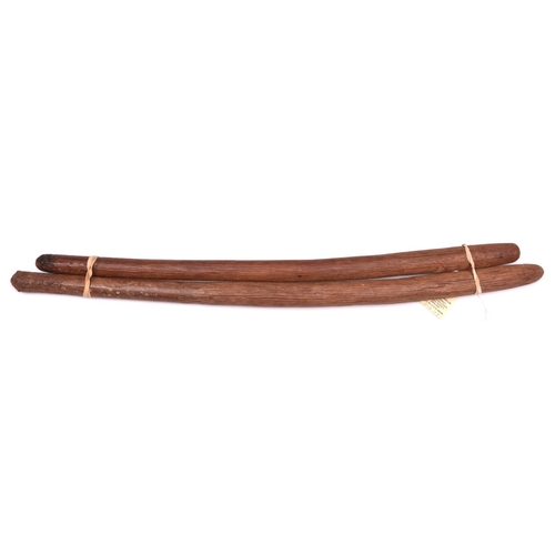 344 - 2 Australian Aboriginal hardwood throwing sticks, of slightly curved form, lightly carved with longi... 