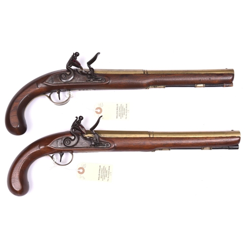 59 - A pair of long 16 bore brass barrelled flintlock duelling pistols, by Robert Wheeler, c 1780,  17½” ... 