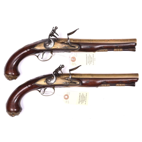 60 - A pair of 18 bore brass barrelled flintlock holster pistols by Brander, c 1760, 13½” overall, 3 stag... 