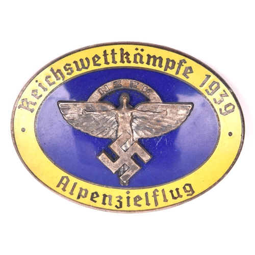 124 - A Third Reich oval enamelled pin back badge,  superimposed in the centre is the NSFK emblem in oxidi... 