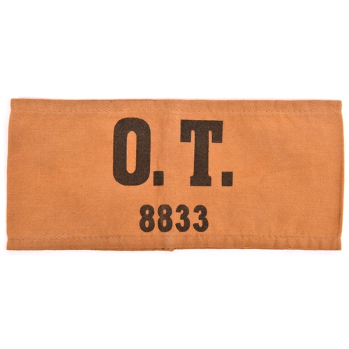 143 - A Third Reich armband,  black “O T 8833” on khaki (Organisation Todt), GC