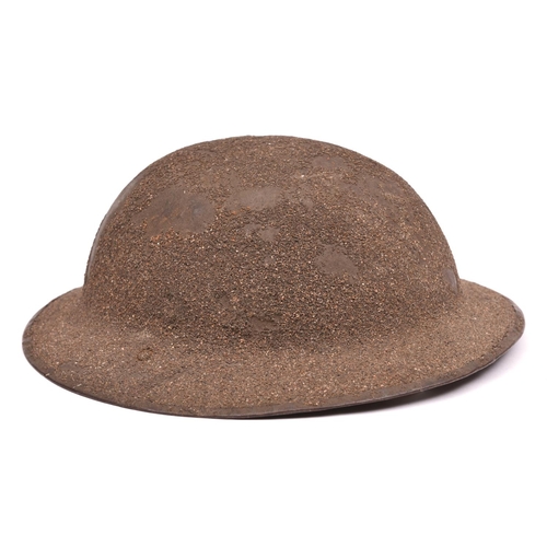 244 - A WWI Brodie’s pattern steel helmet,  rough sanded finish, leather chinstrap with owner’s no and ini... 