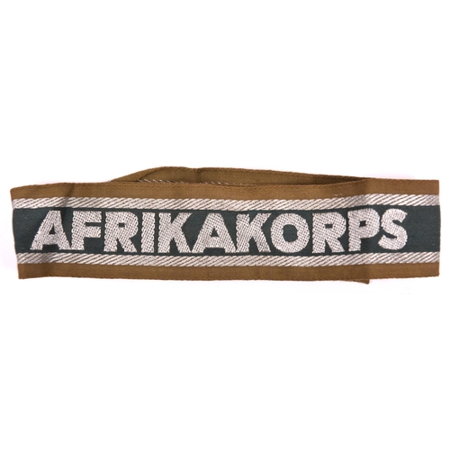 107 - Third Reich silver wire woven “AFRIKA CORPS” cuff title, unissued condition