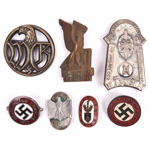 112 - 2 Third Reich pin-back enamel badges. “Deutschland Erwacht 1933” and “Arbeits Dank”; a painted NSDAP... 