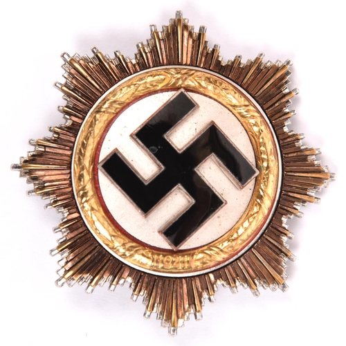 116 - A Third Reich Deutschers Kreuz in gold, with 4 visible hollow rivets and 2 unusual bar fittings (pos... 