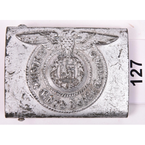 127 - A Third Reich SS man's belt buckle, of silver-painted steel, the back stamped with RZM mark, “155/43... 