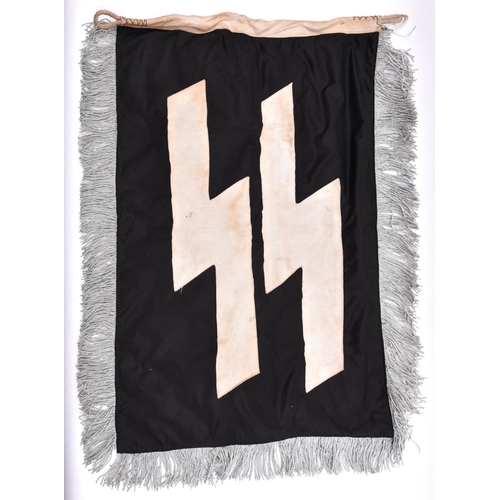 136 - An SS single-sided banner, the top edge with conventional flag-type hoist, the remaining sides havin... 