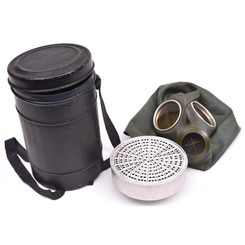 144 - A Third Reich civilian gas mask,  the thin rubber and aluminium filter with clear waffenamt marks. N... 