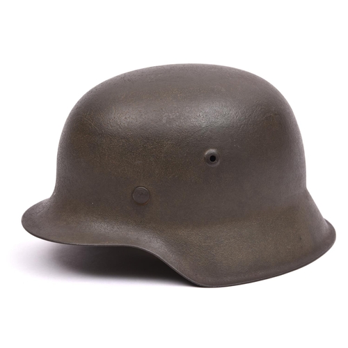 147 - A German M42 single decal Waffen-SS steel helmet, with maker's code and serial number to rear edge(h... 