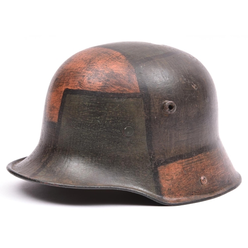 149 - A German M16 steel helmet, with typical camouflage finish and original leather liner. GC (no chinstr... 