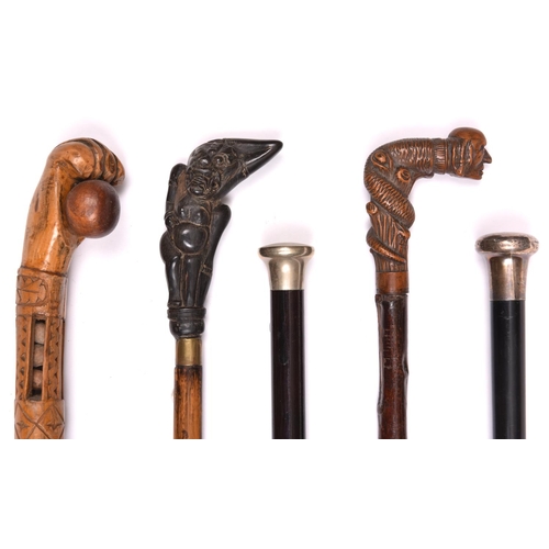 268 - 3 walking sticks: folk art carved boxwood, hollow pierced containing balls and cylinders, with chip-... 