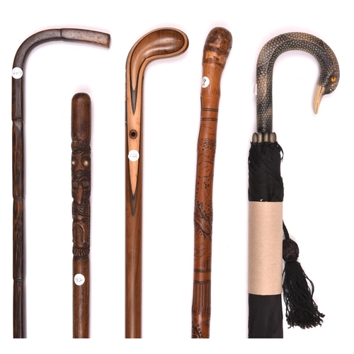 270 - 2 walking sticks laminated and inlaid wood with simple handle reminiscent of early golf clubs; and r... 