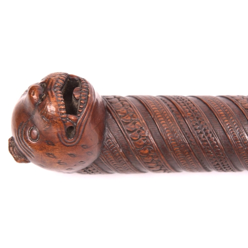 277 - A 19th century Indian hardwood walking cane, the top carved in the form of a “Tipu Sultan” tiger's h... 