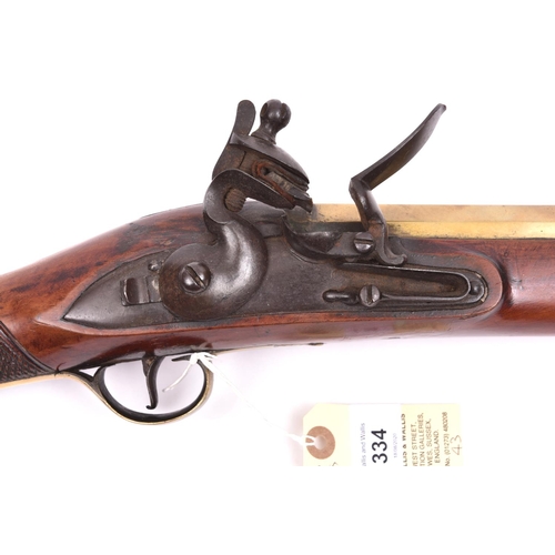 334 - A heavy brass barrelled flintlock blunderbuss of military appearance,  32” overall, unmarked slightl... 