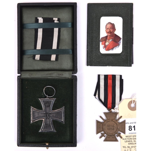 81 - A 1914 Iron Cross 2nd class, in its fitted case with a length of ribbon; a 1914-18 Honour Cross with... 