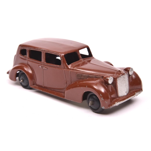 402 - An early Dinky Toys 39 Series Packard Super Eight (39a). An example in dark brown with pale metallic... 