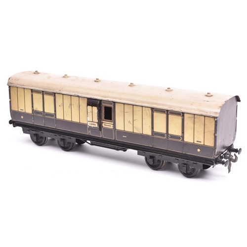 81 - A Carette Gauge 2 L.N.W.R. Passenger Full Brake. A bogie coach in lined brown and cream livery.Equip... 