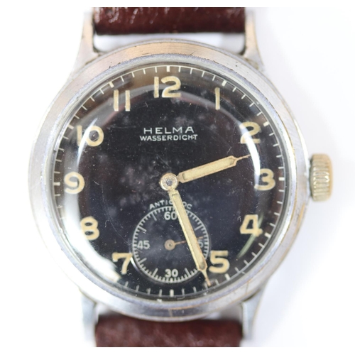 39 - DH marked Helma wristwatch. Serial D 028957 H. Plated case with brushed finish, some wear. Fixed bar... 