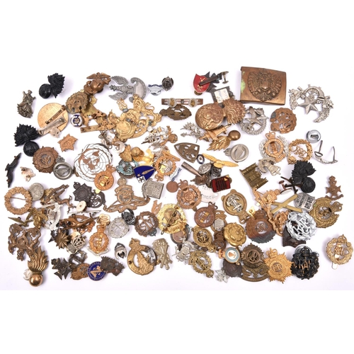 111 - Over 2lbs weight of mostly military badges, British and overseas, including caps, collars, lapels, b... 