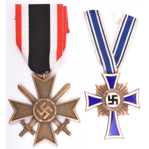 55 - A Third Reich War Merit Cross 2nd class with swords, and a Mother’s Cross, 2nd type, in bronze. GC, ... 