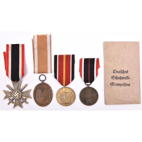 56 - Third Reich medals: War Merit Cross 2nd Class with swords, War Merit Medal, West Wall Medal with pri... 