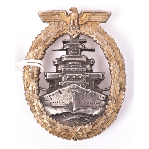 58 - A Third Reich High Seas Fleet badge, with gilt washed wreath and silver/grey centre, the unmarked ba... 