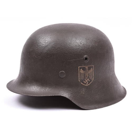 76 - A Third Reich M42 single decal steel helmet, the skull with rough dark grey finish and eagle decal, ... 